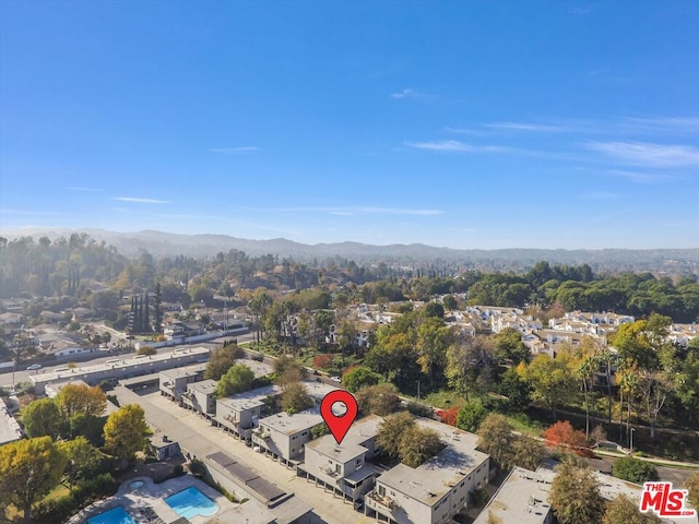 birds eye view of property with a mountain view