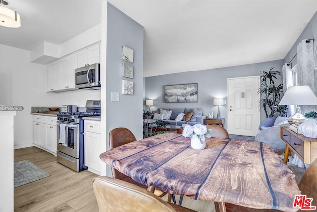 dining space featuring light hardwood / wood-style floors