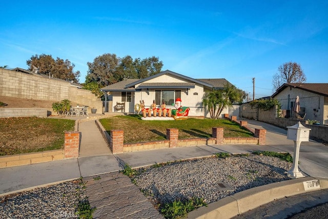 ranch-style home with a patio area and a front yard