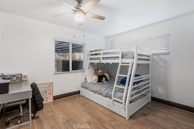 bedroom with ceiling fan and wood-type flooring