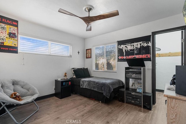 bedroom featuring ceiling fan and hardwood / wood-style floors