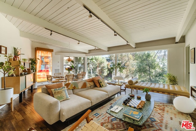 living room featuring beamed ceiling, track lighting, and dark hardwood / wood-style flooring