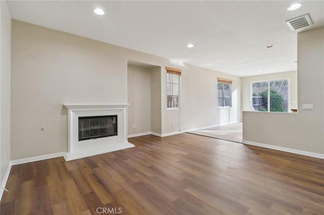 unfurnished living room featuring hardwood / wood-style floors