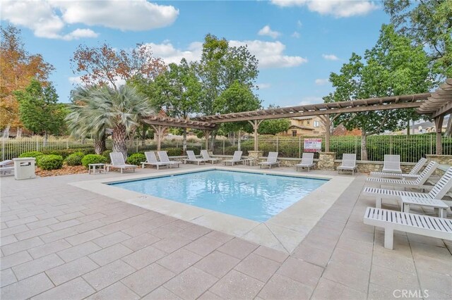 view of swimming pool featuring a pergola and a patio