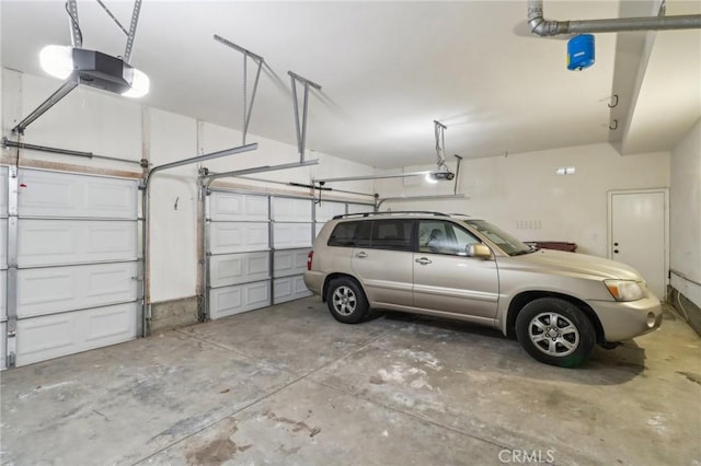 garage featuring a garage door opener