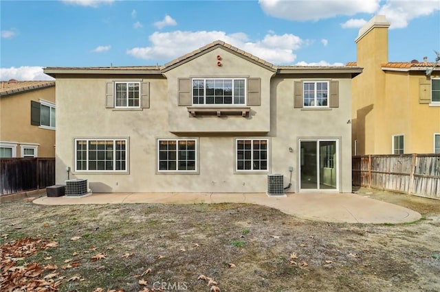 back of house featuring central AC and a patio area