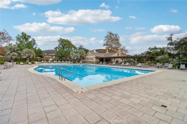 view of pool featuring a patio