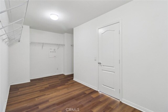 laundry area with dark hardwood / wood-style flooring