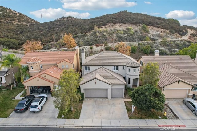 birds eye view of property with a mountain view