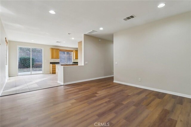 unfurnished living room featuring light wood-type flooring