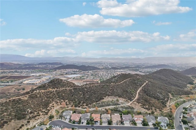 birds eye view of property with a mountain view