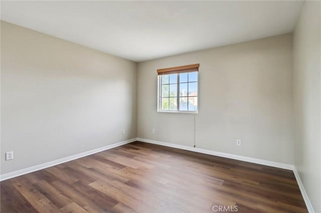 empty room with dark hardwood / wood-style floors