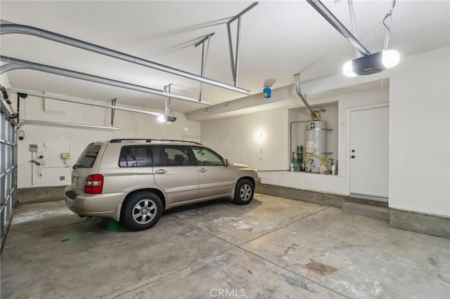 garage with water heater and a garage door opener