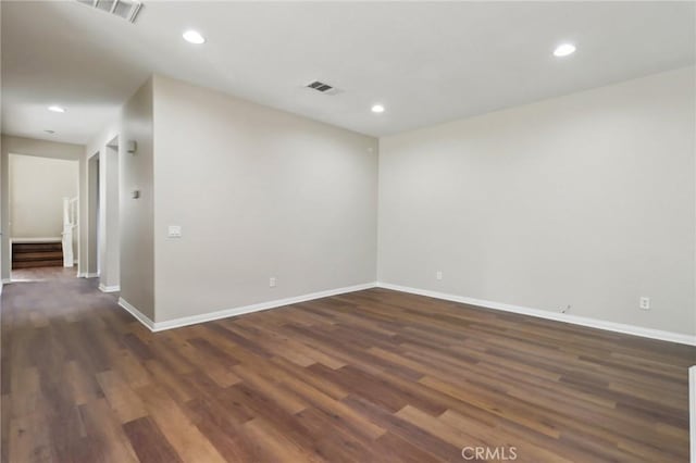 unfurnished room with dark hardwood / wood-style floors