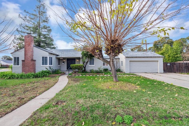 ranch-style home with a front yard and a garage