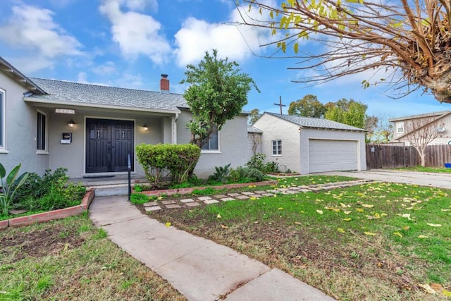 ranch-style house with a garage and a front lawn