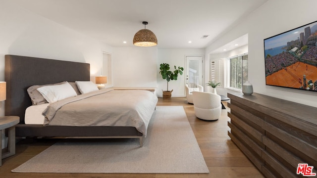 bedroom featuring wood-type flooring