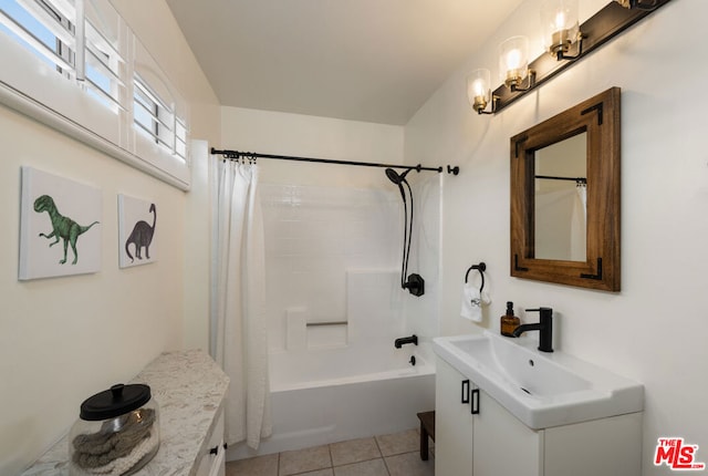 bathroom with vanity, shower / bath combo, and tile patterned flooring