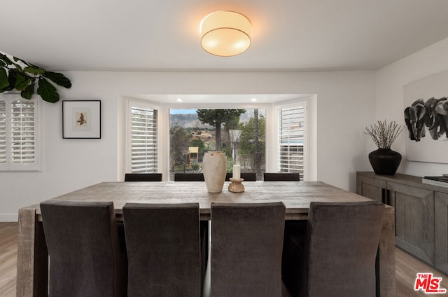 dining space with light wood-type flooring