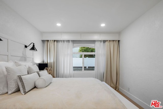 bedroom featuring hardwood / wood-style floors