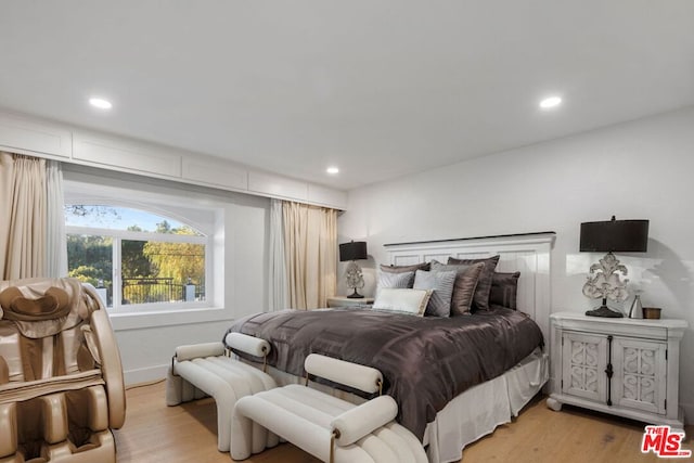 bedroom with light hardwood / wood-style floors