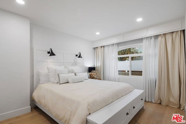 bedroom featuring light wood-type flooring