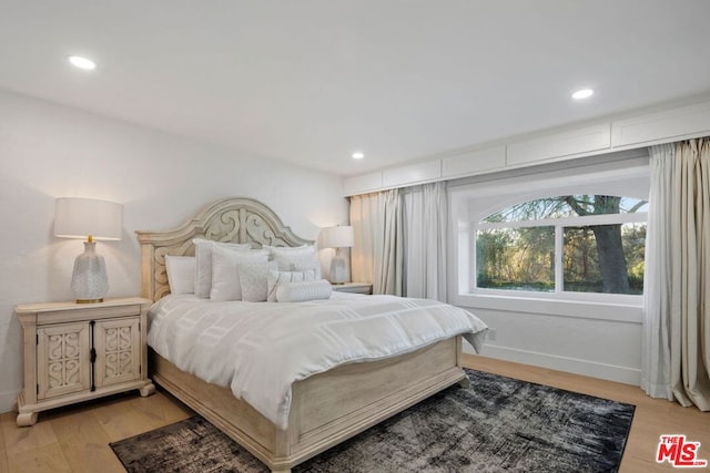 bedroom with light hardwood / wood-style flooring