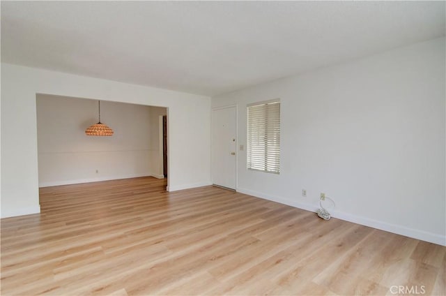 spare room with light hardwood / wood-style flooring