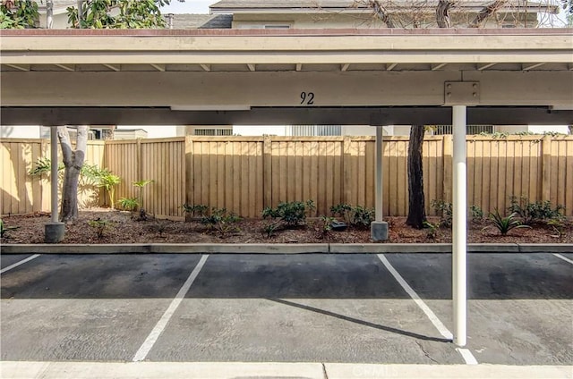 view of vehicle parking featuring a carport