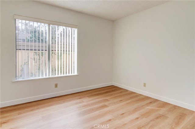 unfurnished room featuring light wood-type flooring