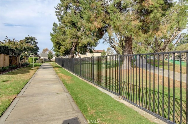 view of property's community with a yard