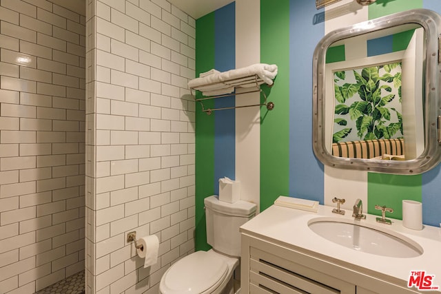 bathroom featuring toilet and vanity