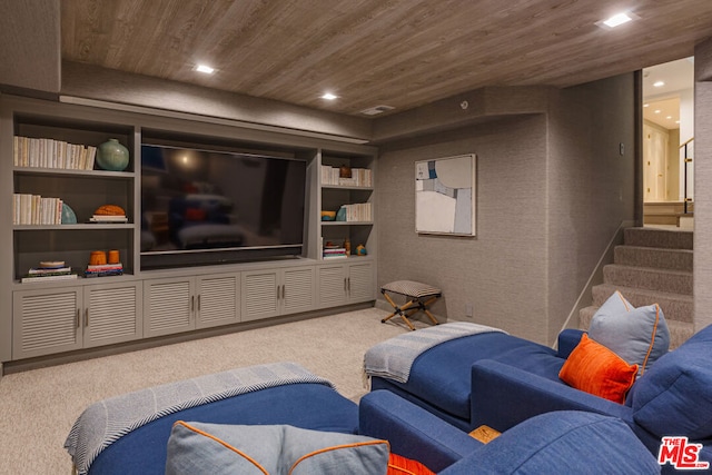 cinema room with carpet and wooden ceiling