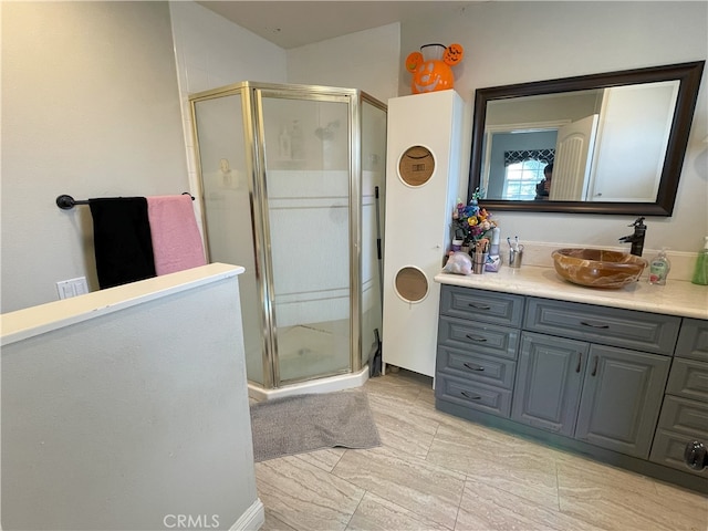 bathroom featuring walk in shower and vanity