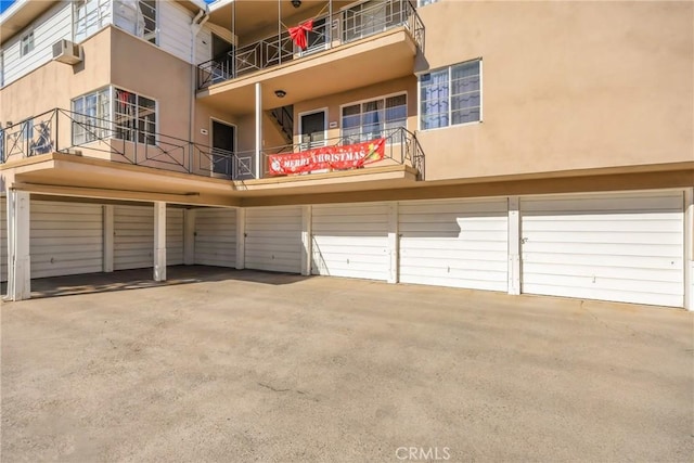 exterior space featuring an AC wall unit