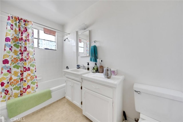 full bathroom with toilet, vanity, and shower / bath combo with shower curtain