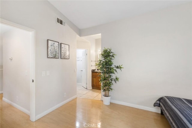 hallway with light wood-type flooring