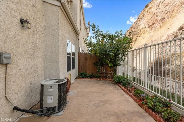 view of home's exterior featuring a patio area and central AC unit