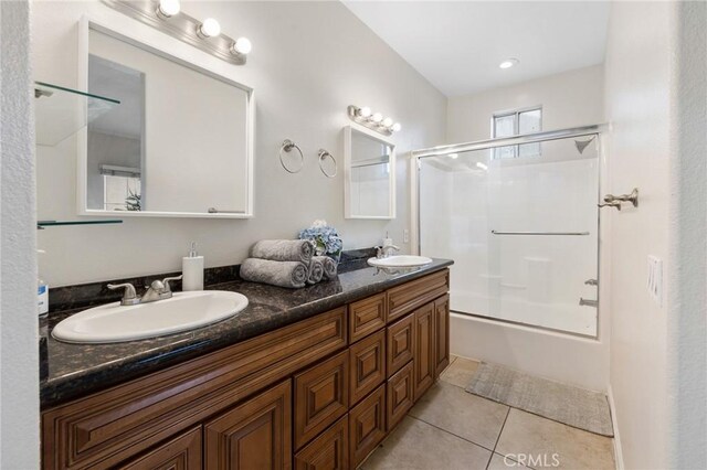 bathroom featuring shower / bath combination with glass door, vanity, and tile patterned flooring