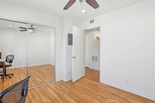 home office featuring ceiling fan and light wood-type flooring