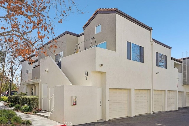 view of side of home with a garage