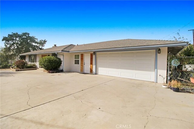 single story home featuring a garage