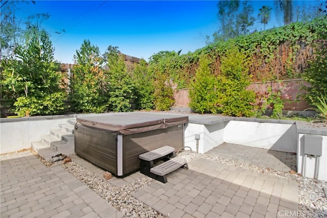 view of patio with a hot tub