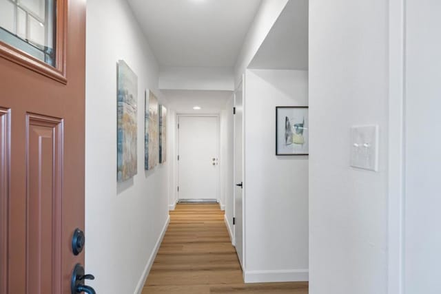 hallway with light wood-type flooring