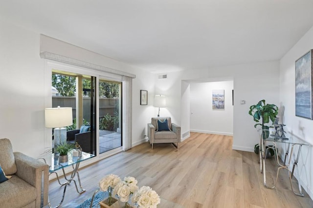 sitting room featuring light wood-type flooring