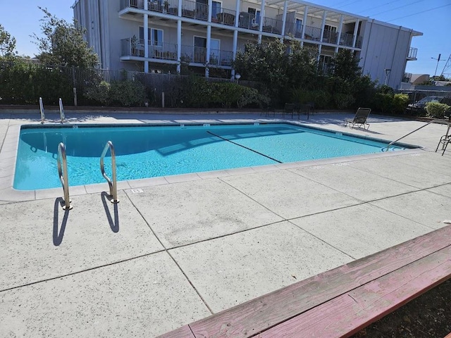 view of pool featuring a patio