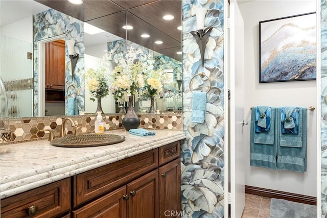 bathroom featuring vanity and decorative backsplash