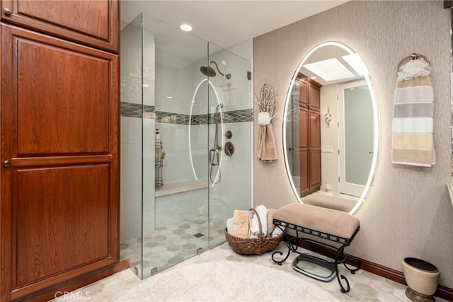 bathroom with a shower with shower door