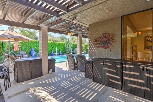 view of patio / terrace with ceiling fan and a pergola