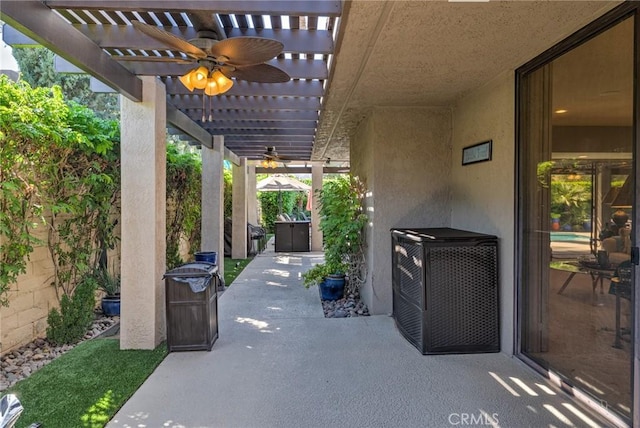 view of patio with ceiling fan and a pergola